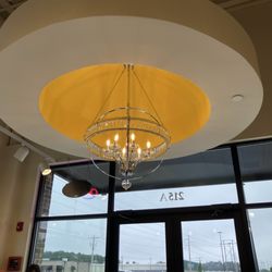 The Toasted Yolk Cafe - Chandelier in the entrance.