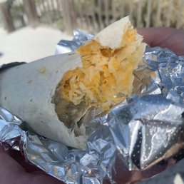"Breakfast burrito" all shredded cheese and a line of nasty watery sausage gravy.. "Breakfast burrito" all shredded cheese and a line of nasty watery sausage gravy..