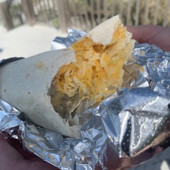 Island Donut - "Breakfast burrito" all shredded cheese and a line of nasty watery sausage gravy.. - Donuts Near Me - Bradenton Beach, Florida Island Donut - "Breakfast burrito" all shredded cheese and a line of nasty watery sausage gravy.. - Donuts Near Me - Bradenton Beach, Florida
