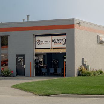 No Time Flat - Our auto shop "Extra Mile Auto Repair" is located in the same building! - Tires Near Me - Jenison, Michigan No Time Flat - Our auto shop "Extra Mile Auto Repair" is located in the same building! - Tires Near Me - Jenison, Michigan