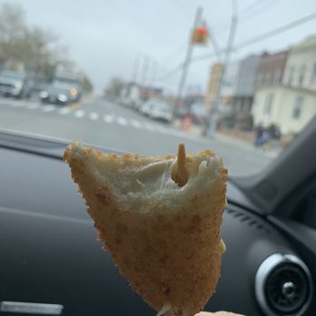 Lily Bloom Bakery - a hand holding a piece of bread - Bakeries Near Me - Brooklyn, New York