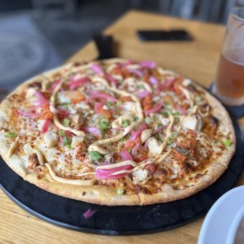 Scout's Pub - a pizza on a table - Burgers Near Me - Franklin, Tennessee Scout's Pub - a pizza on a table - Burgers Near Me - Franklin, Tennessee