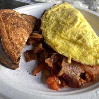 Uptown Cafe - BD omelette, sadly served on a paper plate with plastic utensils for eating at the restaurant. - Cafes Near Me - Tallahassee, Florida
