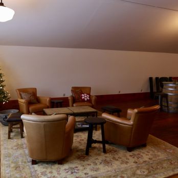 Usurious Wines - a living room with a christmas tree - Wine Tasting Room Near Me - Leavenworth, Washington Usurious Wines - a living room with a christmas tree - Wine Tasting Room Near Me - Leavenworth, Washington