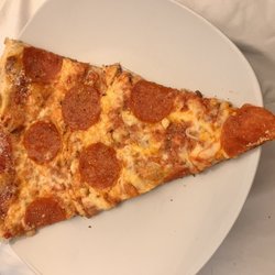 Rizzotto's Pizzeria - Slice of thin crust pepperoni.