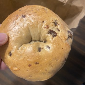 Bagel Bazaar Jackson - a hand holding a bagel - Bagels Near Me - Jackson, New Jersey