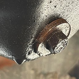 Cross threaded oil pan drain bolt.