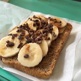 Under the Mango Tree - Chocolate banana toast: sliced banana, cacao nibs, agave and cinnamon. *Daily Special* - Coffee & Tea Near Me - Miami Beach, Florida