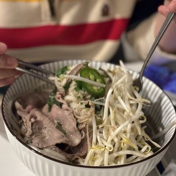 Pho Today - a person eating a bowl of noodles - Vietnamese Near Me - Fort Lee, New Jersey Pho Today - a person eating a bowl of noodles - Vietnamese Near Me - Fort Lee, New Jersey