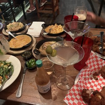 The Eagle Louisville - Our table! Mash Potatoes,Mac and Cheese,Kale Salad, and 2 orders of 1/4 Chicken dark,1 of 1/4 Chicken white,1 of Drumsticks (5) - Southern Near Me - Louisville, Kentucky