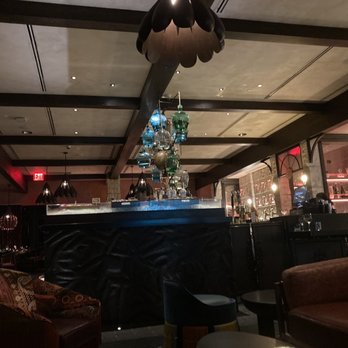 Como Como - Bar area, part view of Tequila/Liquor cabinet - Seafood Near Me - Miami Beach, Florida