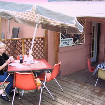 Teresa's Tamales - a woman sitting at a table outside - Mexican Near Me - Cleveland, New Mexico Teresa's Tamales - a woman sitting at a table outside - Mexican Near Me - Cleveland, New Mexico