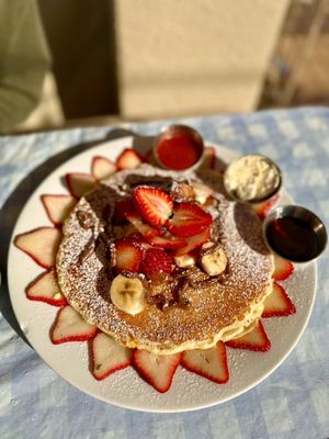 Photo of Immigrant Son Caffe - Ventura, CA, US. Pancakes with strawberries bananas and Nutella.