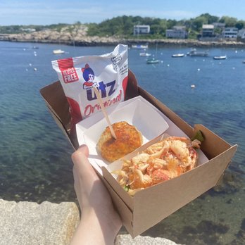 Roy Moore Lobster - Lobster roll, stuffed clam with Rockport Harbor in the background. Enjoy it by John Walker Gallery at the top - Seafood Near Me - Rockport, Massachusetts Roy Moore Lobster - Lobster roll, stuffed clam with Rockport Harbor in the background. Enjoy it by John Walker Gallery at the top - Seafood Near Me - Rockport, Massachusetts