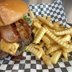Bullseye Burger Loaded Grill onions & Jalapeno, lettuce, tomatoe, pickles, cheese, bacon with our spice mayo fries and a 32 oz agua fresca