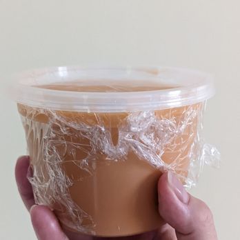 Ayothaya Thai Kitchen - Iced Thai milk tea to go. You do need to transfer it to a cup to enjoy. No leakage! - Thai Near Me - Oshawa, Ontario