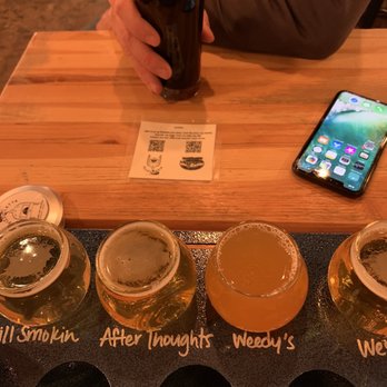 Dark Sky Brewing - Sitting at a table. Gluten reduced flight in foreground. YUM! - Breweries Near Me - Flagstaff, Arizona