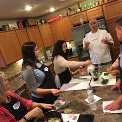 Taz Cooks Cooking Classes - Taz explaining the origin of Jamaican Festival Dumplings & Root Beer Spiced Apples.  Both were new and delicious flavors to me!