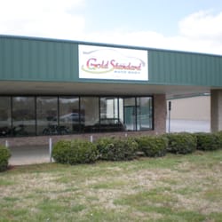 Gold Standard Auto Body - Showroom area where we keep a collection of vintage cars and motorcycles . Stop in and see us .
