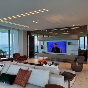 SAV Technology - Living room home theater with wall mounted Samsung Frame TV with invisible in-ceiling speakers and full automation with wi-fi remote - Home Theatre Installation Near Me - Hialeah, Florida