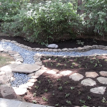 Deeply Rooted Design - Rain garden with stone bridge - Landscaping Near Me - Thurmont, Maryland