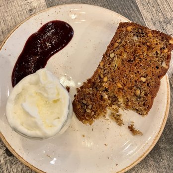 The Aussie Grind - Banana bread with walnuts - comes served with sweet cream and berry sauce - Cafes Near Me - Frisco, Texas The Aussie Grind - Banana bread with walnuts - comes served with sweet cream and berry sauce - Cafes Near Me - Frisco, Texas