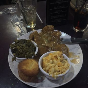 Boss Queens Soul Cafe - Smothered pork chop with greens, Mac & cheese, and cornbread - Soul Food Near Me - Norfolk, Virginia