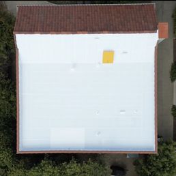 The yellow object is a new hatch SLR installed on the pitched part of the roof.