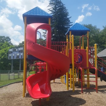 Donatoni Community Park - Twisty Slide (front) and Covered Picnic Tables (back right) - Playgrounds Near Me - Rockaway, New Jersey Donatoni Community Park - Twisty Slide (front) and Covered Picnic Tables (back right) - Playgrounds Near Me - Rockaway, New Jersey