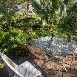 Garden table by waterfall