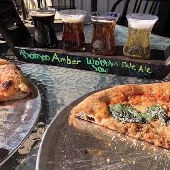 Johnson County Distillery - Beer flight and pizza on the patio - Distilleries Near Me - Cleburne, Texas
