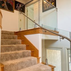 LA Railings - Custom frameless glass staircase installation in Los Angeles. High-end stainless steel hardware meets modern luxury and structural safety.
