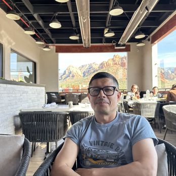 Shorebird - View of balcony tables, skyline, & my sweet husband. - Breakfast & Brunch Near Me - Sedona, Arizona
