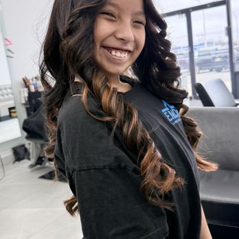 J3 Hair Studio - Happy kid with her curls - Hair Salons Near Me - Levittown, New York