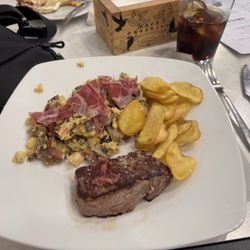 Cafe Lago Correo, 13 - Steak, Chips and mushrooms, shrimp, spanish ham, and eggs all in an assortment.