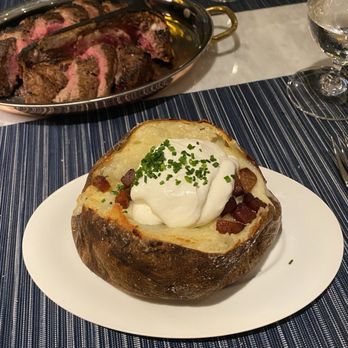 Smoke & Cedar Steakhouse - A "loaded" potato, it made me sad. Look at it people, it looks surprisingly like a Wendy's potato. - Steakhouses Near Me - Auburn, Washington Smoke & Cedar Steakhouse - A "loaded" potato, it made me sad. Look at it people, it looks surprisingly like a Wendy's potato. - Steakhouses Near Me - Auburn, Washington