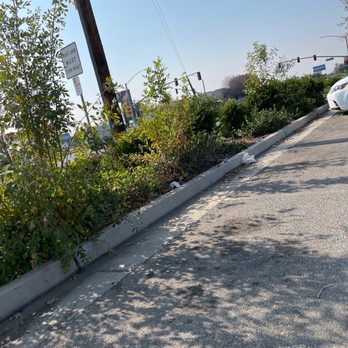 CVS Pharmacy y más - a car parked on the side of the road - Drugstores Near Me - BAKERSFIELD, California
