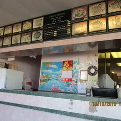 Hong Kong Chinese Restaurant - Hong Kong Kitchen: Front counter & menu board.