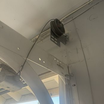 NOL Garage Doors - Orange County - A pic of the worn out pulley system. - Garage Door Services Near Me