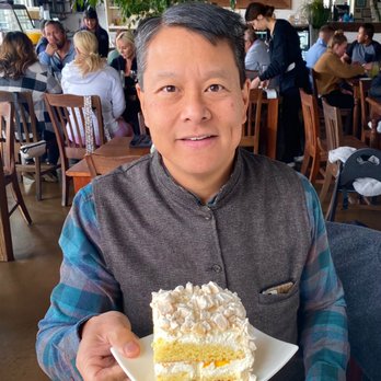Asado Argentinian Grill - Chaja, which is the House Special Cake. It's moist layers of yellow cake with whipped cream and peaches, topped with crumbled meringue. - Argentine Near Me - Orem, Utah