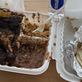 Tienda Mi Pueblito - My partially-eaten takeout box with chicken in mole sauce, rice, and refried beans. - Mexican Near Me - Seattle, Washington Tienda Mi Pueblito - My partially-eaten takeout box with chicken in mole sauce, rice, and refried beans. - Mexican Near Me - Seattle, Washington