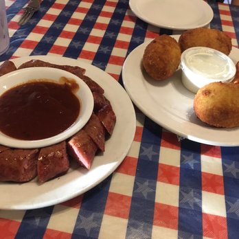 T-Bone Tom's - Sausage on the left and armadillos eggs to the right - Barbeque Near Me - Kemah, Texas T-Bone Tom's - Sausage on the left and armadillos eggs to the right - Barbeque Near Me - Kemah, Texas