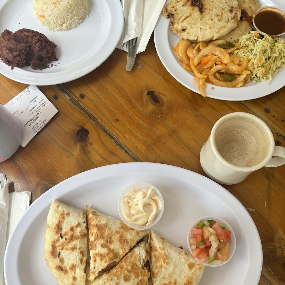 Chicken and cheese quesadilla, pupusa, rice, refried beans Chicken and cheese quesadilla, pupusa, rice, refried beans
