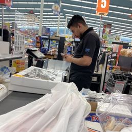 NOT PAYING ATTENTION TO HIS CUSTOMERS. BUSY ON THE PHONE, PROBABLY NOT DOING ANYTHING PRODUCTIVE!