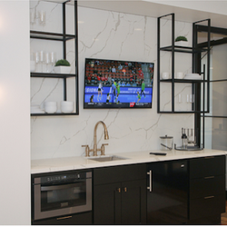 Barney Miller's - A bar area also features a small flat panel.