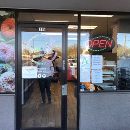 Exterior outside entrance of Original Rainbow Donuts Cafe - many people waiting in line but totally worth it - Scottsdale, Arizona Exterior outside entrance of Original Rainbow Donuts Cafe - many people waiting in line but totally worth it - Scottsdale, Arizona