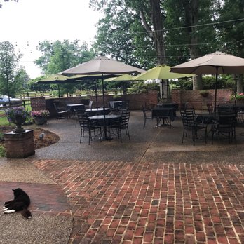 Lola's Farmhouse Bistro - Patio is a bit damp today, but it beautifully designed - Italian Near Me - Manakin-Sabot, Virginia
