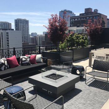 Botanical Concepts Chicago - a rooftop patio with a fire pit - Landscaping Near Me - Chicago, Illinois Botanical Concepts Chicago - a rooftop patio with a fire pit - Landscaping Near Me - Chicago, Illinois
