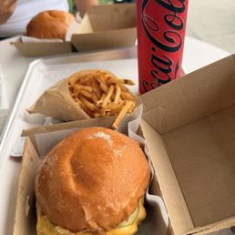Single burger with fries and a fridge cigarette