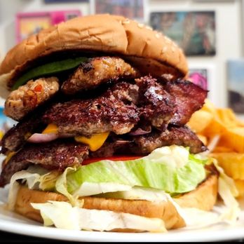 New Taraval Cafe - Not for the faint of heart. The Miracle Burger includes double smash patties, bacon, hot Italian sausage, avocado, cheese and fixings. - Breakfast & Brunch Near Me - San Francisco, California New Taraval Cafe - Not for the faint of heart. The Miracle Burger includes double smash patties, bacon, hot Italian sausage, avocado, cheese and fixings. - Breakfast & Brunch Near Me - San Francisco, California